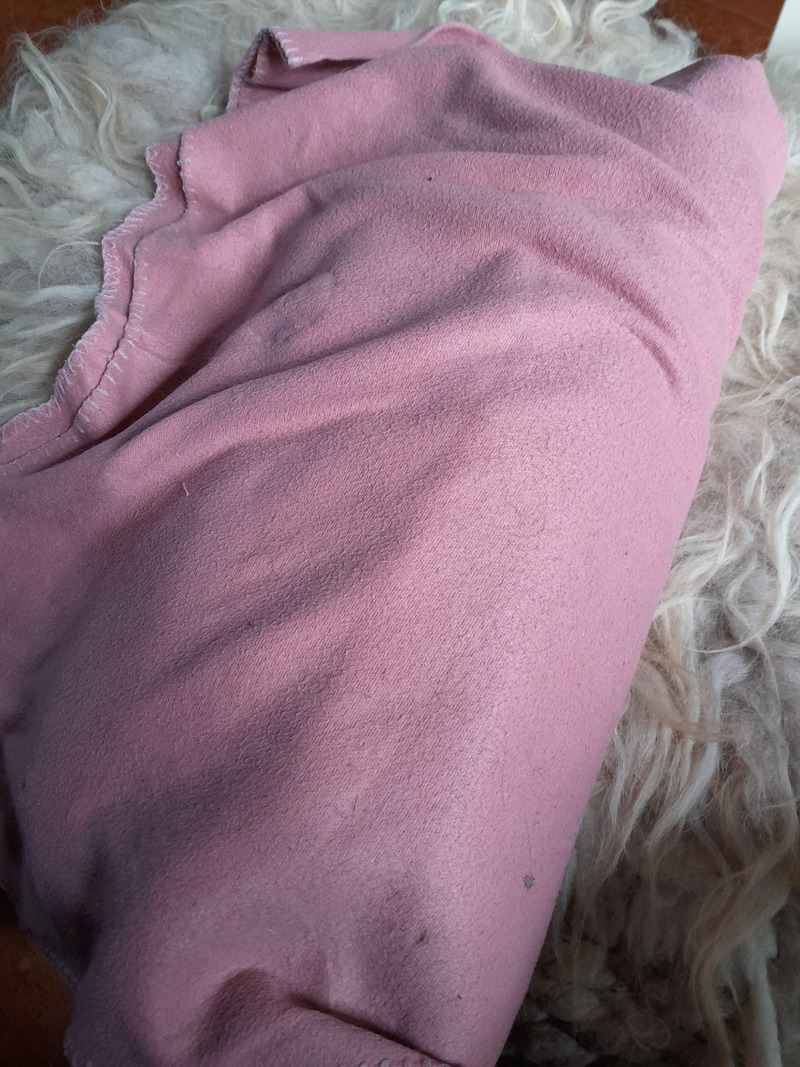 fleece blanket folded right to left over the first layer of blanket
